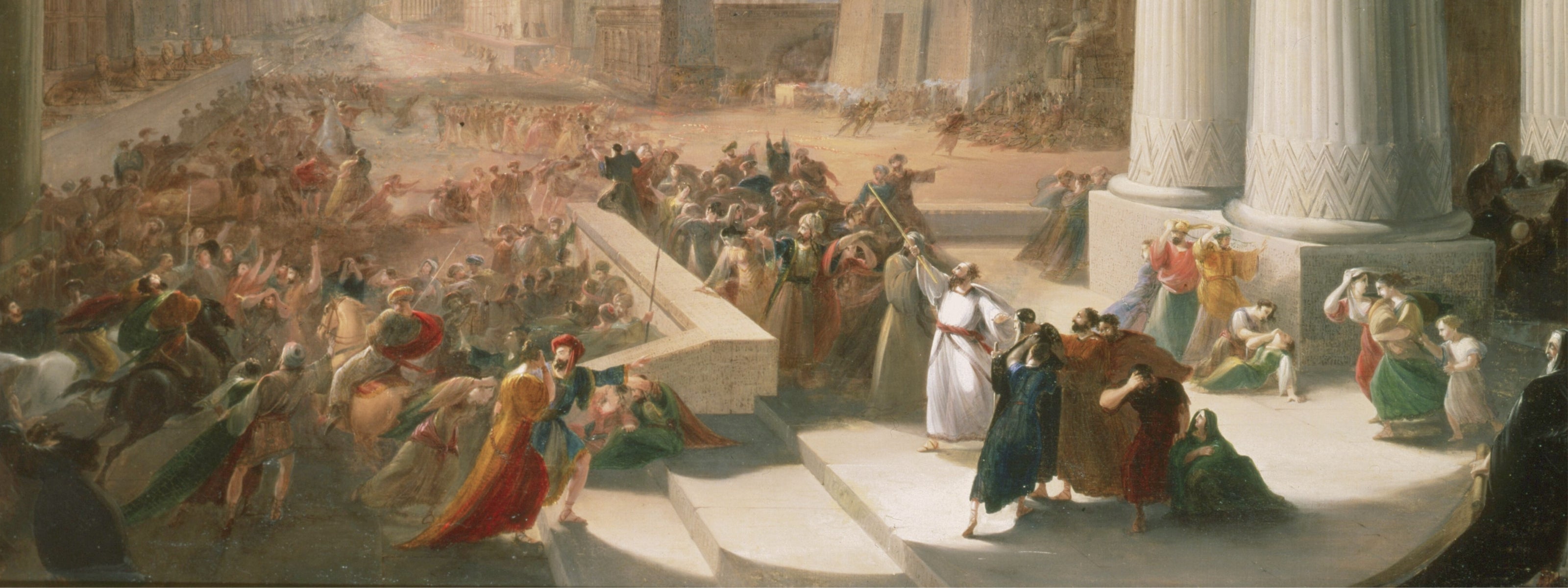 A dramatic 14th-century scene depicting the chaos and despair of the bubonic plague. Crowds of people, dressed in period garments, are in turmoil—some fleeing in panic, others mourning their fallen loved ones. In the foreground, a man in a flowing white robe with a red sash raises his arms, possibly a physician or religious figure attempting to bring order or provide comfort. Women clutch their heads in grief, while others tend to the sick and dying. The towering columns suggest a city square or temple, a s